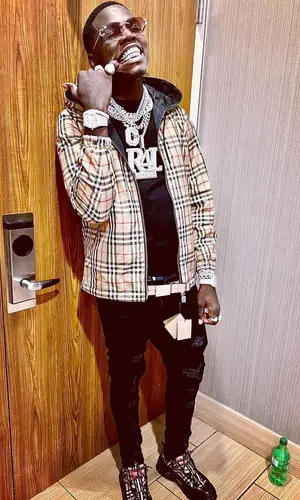 Big Boogie wearing Burberry jacket
