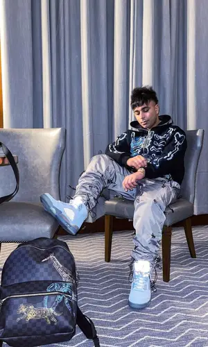 Gurinder Gill wearing Louis Vuitton backpack