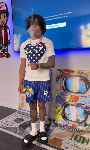 King Cid wearing Gucci sandal
