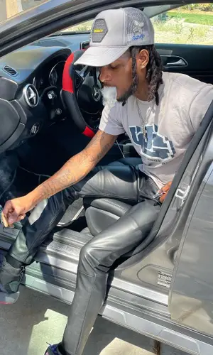 BigBabyGucci wearing Bstroy cap