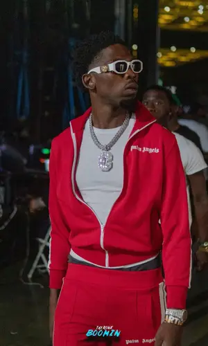 BlocBoy JB wearing Palm Angels pants