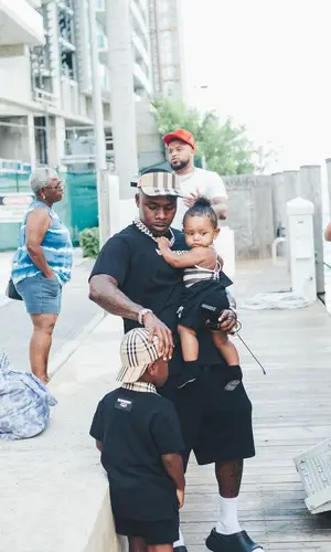 DaBaby wearing Burberry shorts