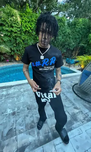 Kankan’s Outfit in Nue Trons T-Shirt, Vital Worldwide Pants & Louis Vuitton Jewelry (2022)