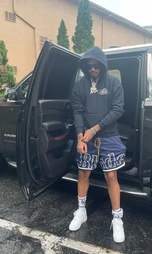 Lil Dude wearing Rhude sock