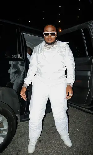 Saucy Santana wearing Louis Vuitton pants