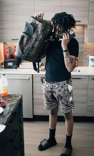 Kankan’s Outfit in Amiri Shorts & Louis Vuitton Backpack (2022)