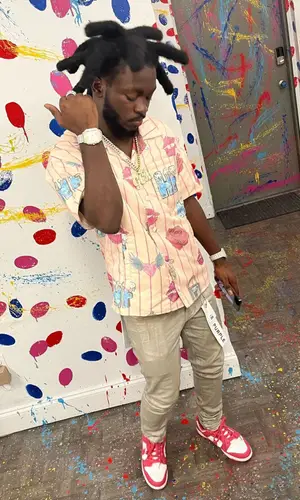 LPB Poody wearing Nike sneakers