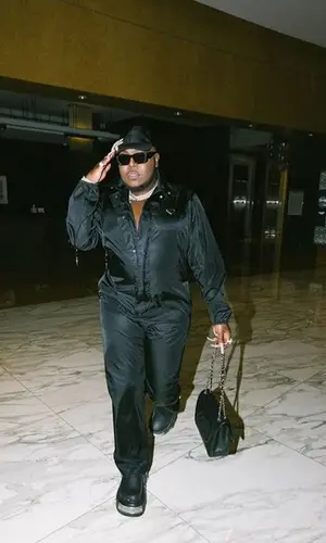 Saucy Santana’s Outfit in Prada Cap, Balenciaga Sandals & Crocs (2022)