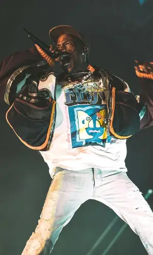 Travis Scott wearing Dior belt