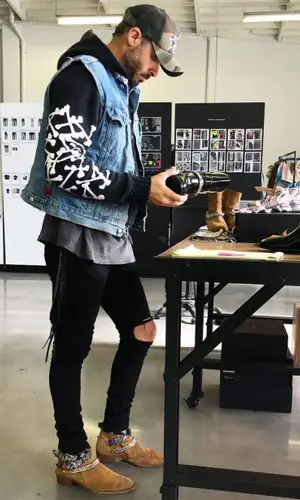 Mike Amiri wearing Amiri hoody