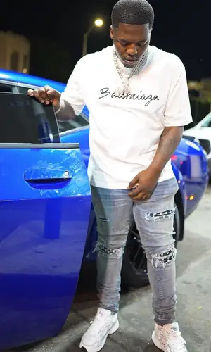 Lil Zay Osama wearing Dior sneakers