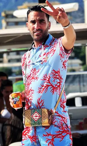Heuss L'enfoire wearing Dolce & Gabbana shirt