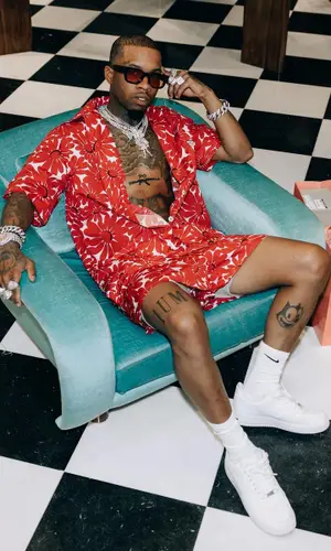 Tory Lanez’s Outfit in Prada Shirt & Nike Socks (2022)