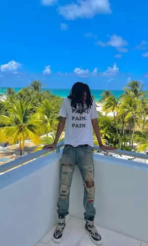 Sid Shyne wearing Number (N)ine t-shirt