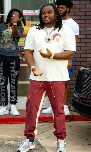 Tee Grizzley wearing Rhude t-shirt
