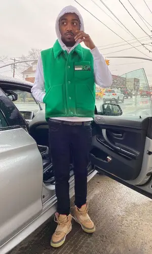 Swoosh God wearing Prada jacket