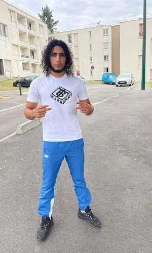 Isk wearing Burberry t-shirt