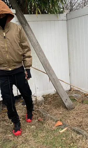 Swoosh God wearing Barriers hoody
