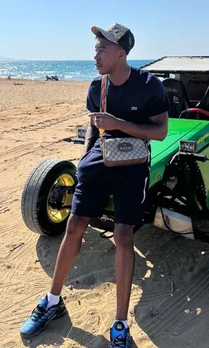 Fresh laDouille wearing Gucci hat
