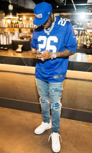 Fivio Foreign wearing New Era jersey