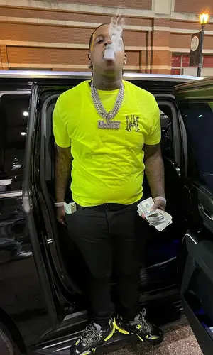 Finesse2tymes wearing Amiri t-shirt