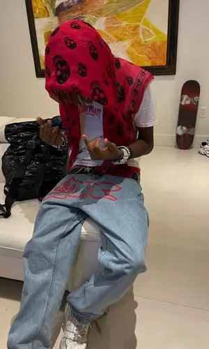 Midwxst wearing Alexander McQueen scarf