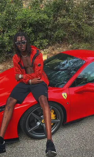 Koba Lad wearing Louis Vuitton sneakers