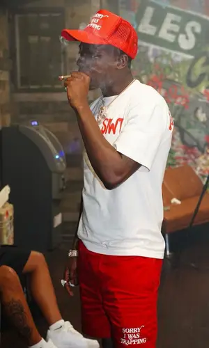 Bobby Shmurda’s Outfit in Lanvin Sneakers & Sorry I Was Trapping Cap (2022)