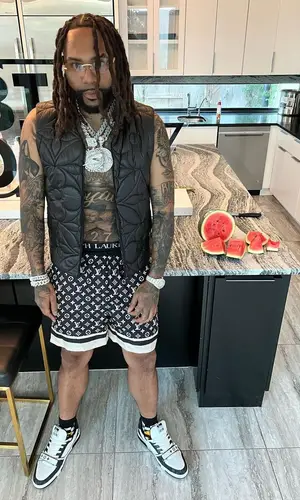 Money Man wearing Louis Vuitton shorts