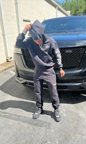 Lil 50 wearing Amiri pants