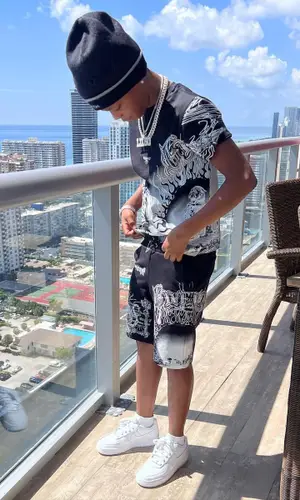 Lil 50 wearing Givenchy pants
