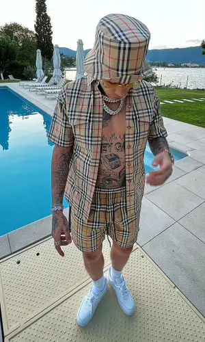 Sfera Ebbasta wearing Burberry swimwear