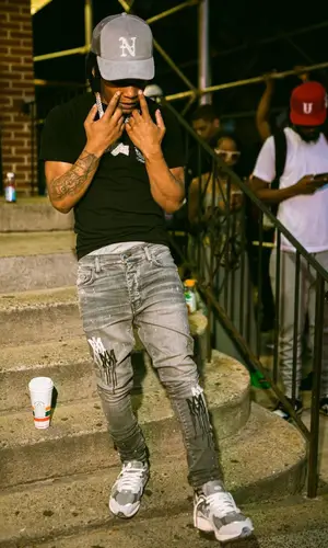 B Lovee’s Outfit in Amiri Jeans, New Balance Sneakers & Nahmias Cap (2022)