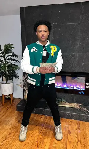 Luh Kel wearing Palm Angels jacket