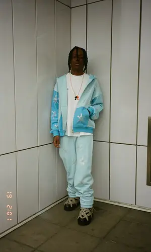 Skaiwater wearing Moncler boots