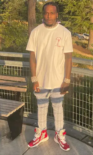 Sauce Walka wearing Purple Brand jeans