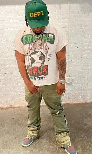 Don Q wearing Gallery Dept. t-shirt