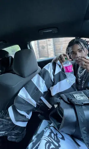 Onlybino wearing Vivienne Westwood backpack