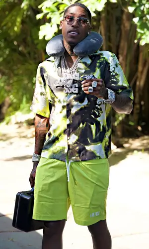CoreySSG wearing Amiri shorts