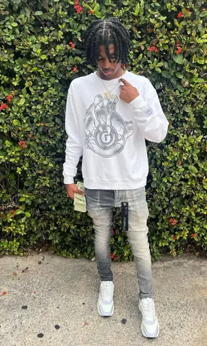 Lil Darius wearing Gallery Dept. sweater
