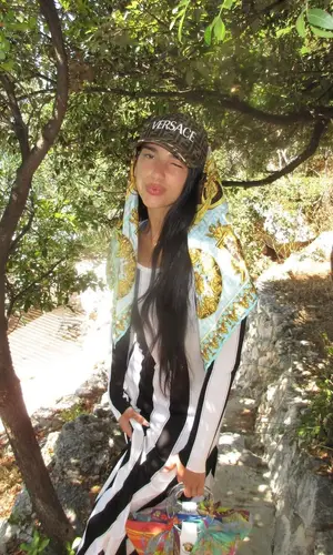 Dua Lipa wearing Versace bag