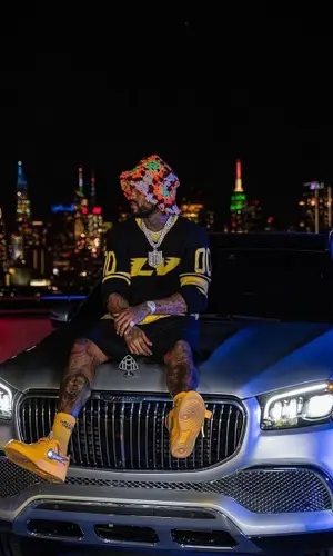 Dave East wearing Louis Vuitton t-shirt