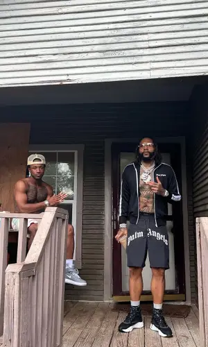 Money Man wearing Palm Angels shorts