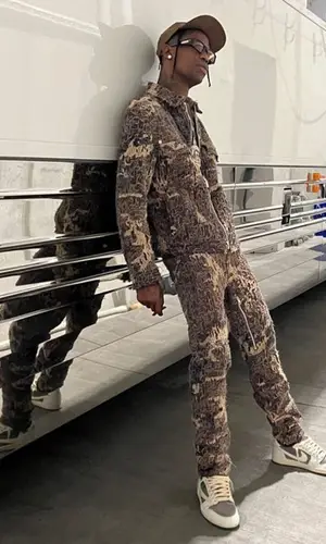 Travis Scott wearing Givenchy jacket