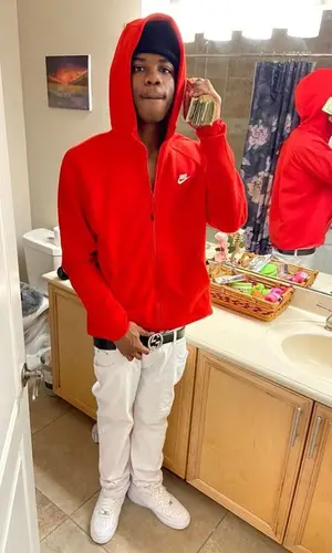 Smokingskul wearing Nike hoody