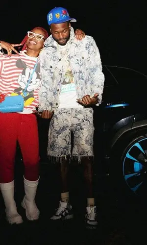 Meek Mill wearing Louis Vuitton bag