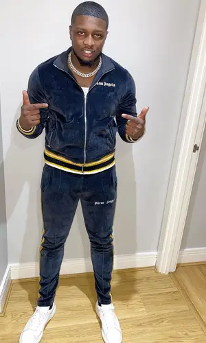 Swarmz wearing Palm Angels jacket