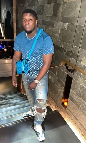 Swarmz wearing Louis Vuitton bag