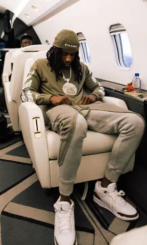Polo G wearing Louis Vuitton backpack
