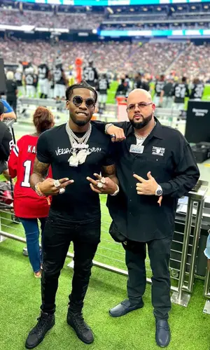 CJ So Cool wearing Versace belt